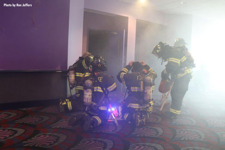 Firefighters mask up during a drill