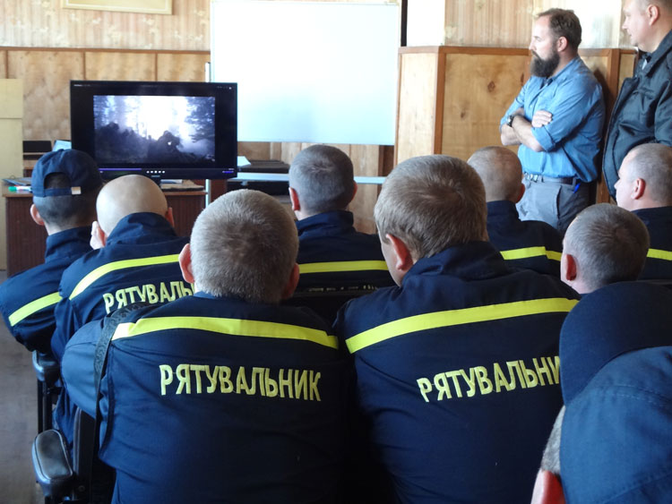 Firefighters watch a training video