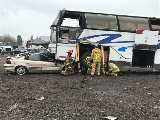 Firefighters prepared to lift bus during extrication