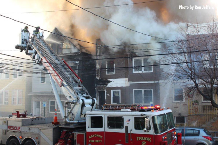 Firefighters in tower ladder at Bayonne fire