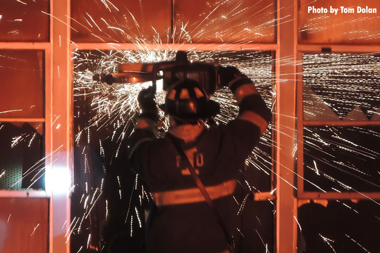 Firefighter making cut with circular saw