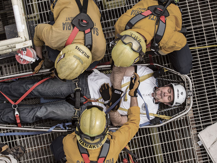 Rescuers assist an injured worker