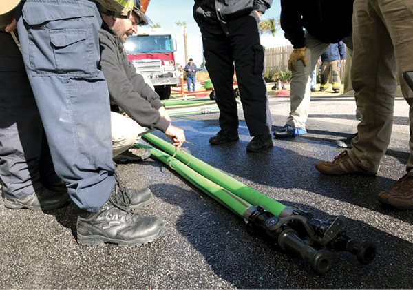 A side-by-side comparison of two-inch hose with 2½-inch couplings and a recent development—hose with an inside diameter of exactly 2¼ inches. (Photo by Al Zuccarelli.)