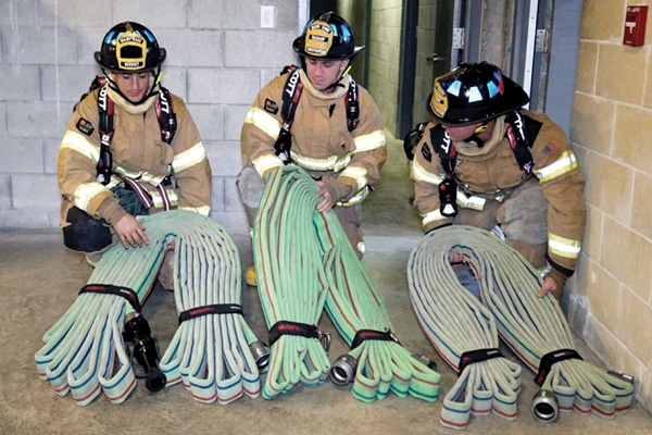 Three bundles of 75-foot sections of two-inch hose configured into horseshoes. (Photo by Ricardo Stephens.) 