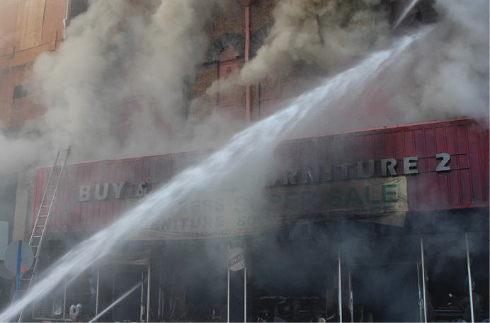 Master streams operate in front of the building as the fire is brought under control. (Photo by Ron Jeffers.) 