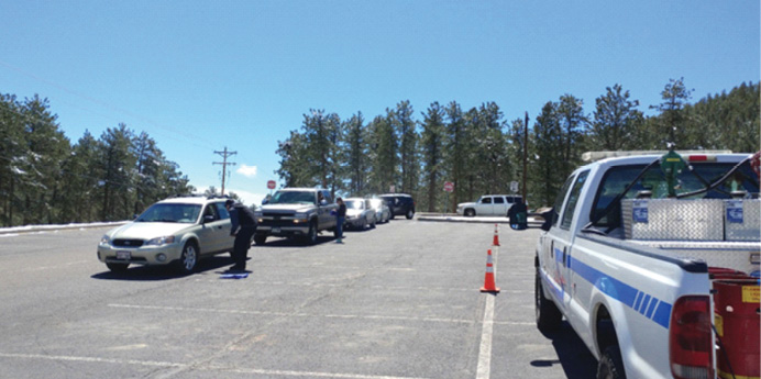 Firefighters gather information from civilian evacuees during a planned wildfire evacuation drill. (Photos by author.)