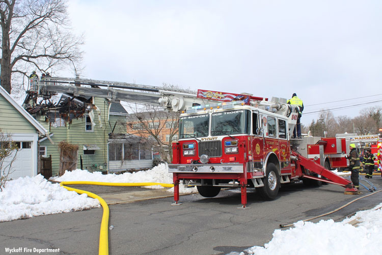 Tower ladder in use at scene of Ramsey house fire