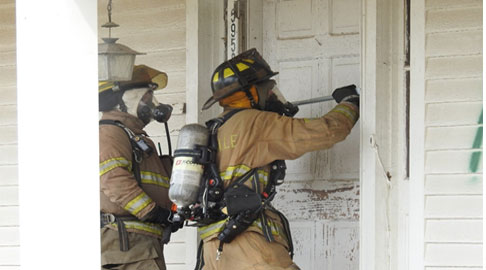 Firefighters force entry during drill