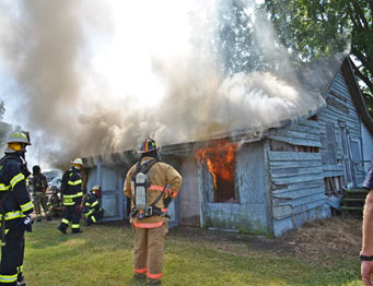 Live burn instructors monitor conditions