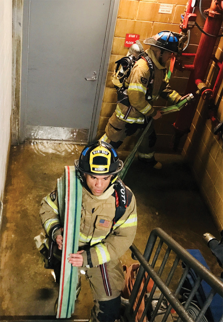 Charging a second hoseline from a standpipe. (16) Connect the hose bundle to an outlet two floors below the fire and stretch it up the stairs. (Photos 16-18 by Shawn Thompson.) 