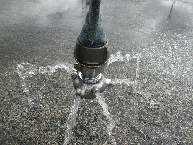 (21) A close-up of a Bresnan distributor nozzle, which rotates as water is discharged through the holes. 