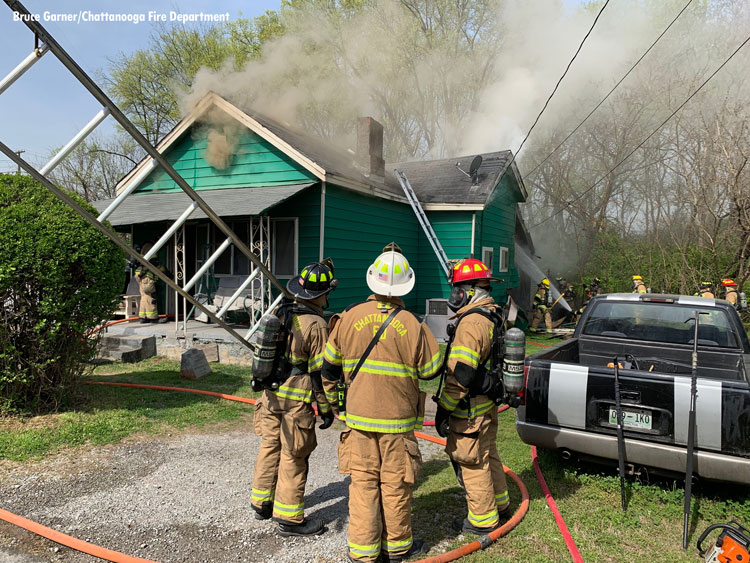 Firefighters at scene of house fire