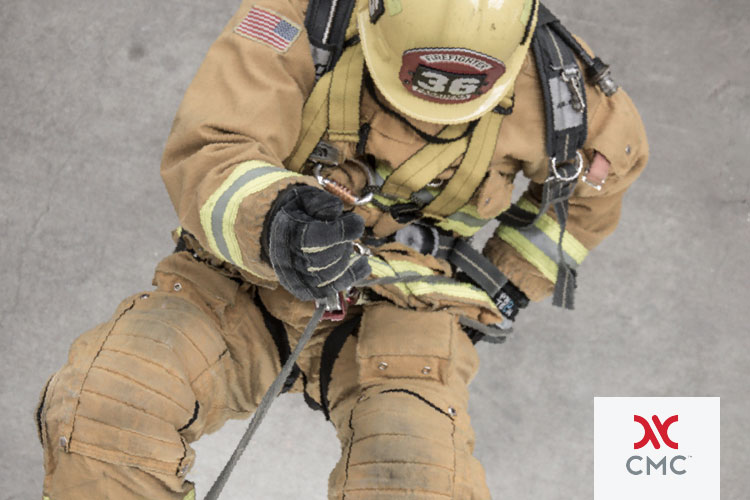 Firefighter rappelling with CMC unit