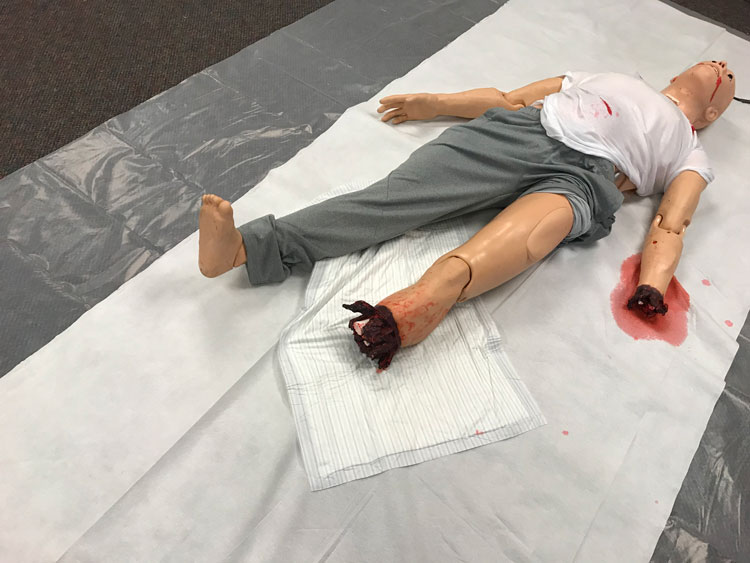 Faux victim with moulage at active shooter training drill