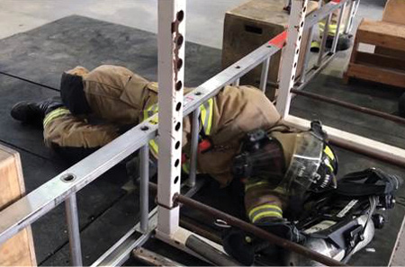 (7) Adding a communications component during Mayday drills is an absolute must. Start with the firefighter performing a fireground action (e.g., a search) and end with the firefighter  successfully overcoming the emergency. During the drill, he should call the Mayday as soon as he thinks he might be in trouble. When possible, get dispatch involved in this training. (Photo by author.)