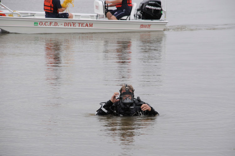 A fire department diver undertakes dive operations