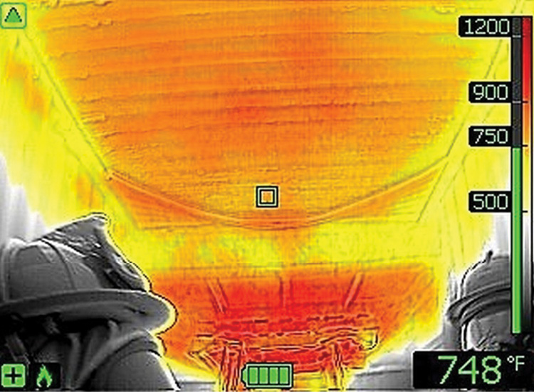 (1) Use your thermal imaging camera (TIC) to locate the flow path, to consider cooling, and as a guide to find the fire. (Photos by author.)