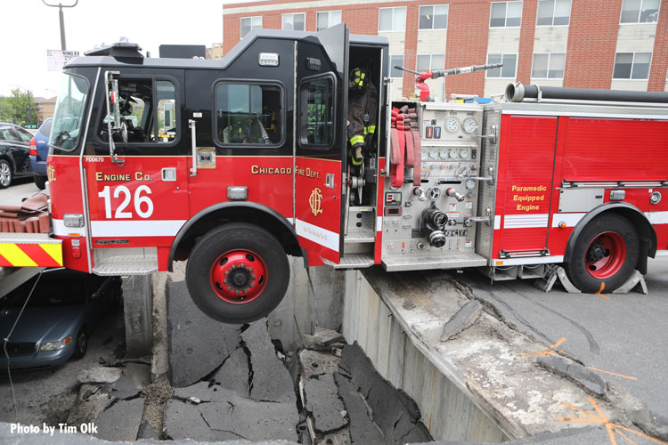 Chicago fire truck nearly falls into hole