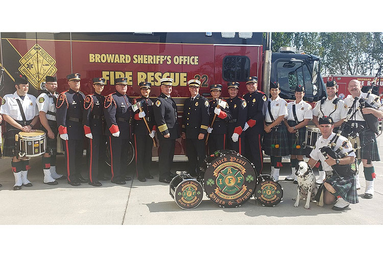 Todd LeDuc and members of Black Pearl Pipes and Drums