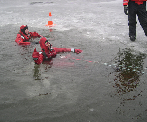 Technicians can serve as ice screws in open water when the ice has been destroyed as long as they have good fins and effective training in kicking. (Photos 6-9 by Andrea Zaferes.) (