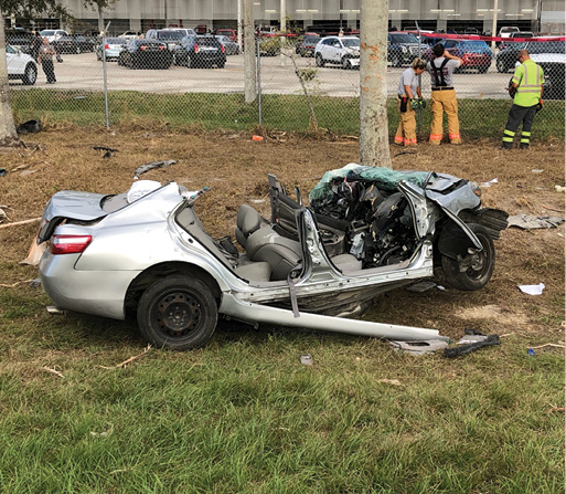 The area where another MDFR apparatus was positioned to employ a fifth winch to establish the control or the tie-back line, off the highway opposite of where the rotator was positioned. Crew members are securing the fence that was cut to access that parking lot.