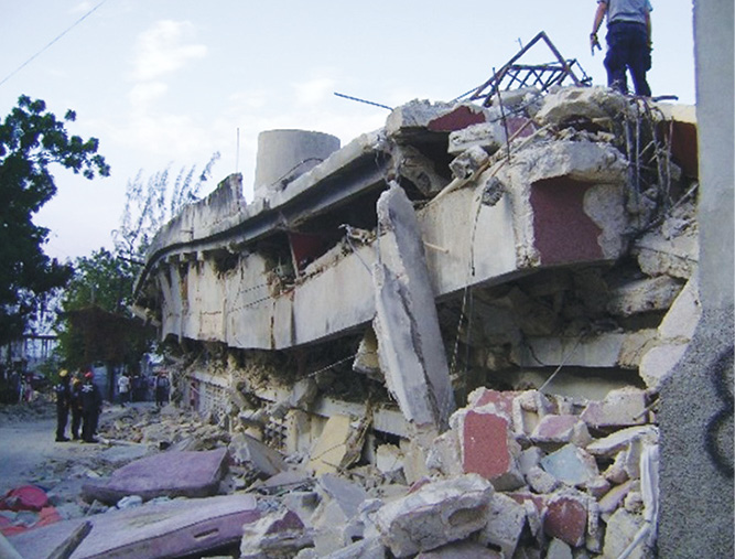 Task force members assess a pancake collapse of an apartment in Port-au-Prince, Haiti. (Photos by author.)