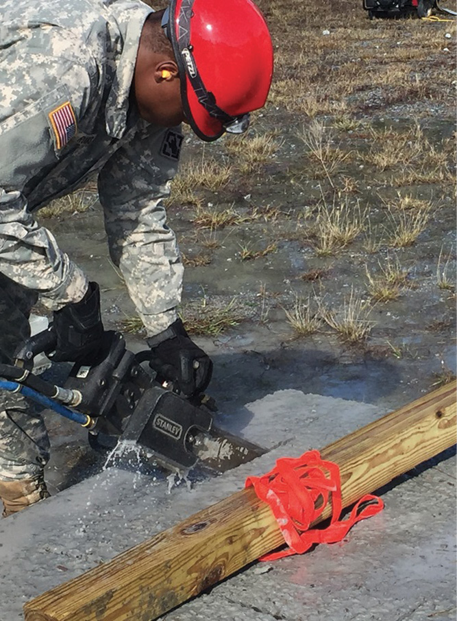  A six-inch rebar rod is fed through the inspection hole and webbed to the lumber to secure the concrete in the bevel cut, clean breach.