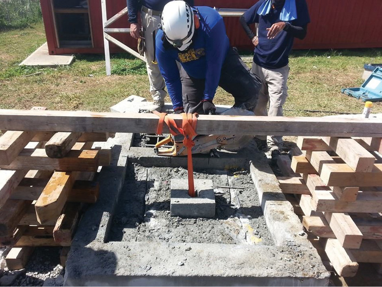 Rescuers from Puerto Rico are using rebar inserted into the inspection hole to support the concrete. 