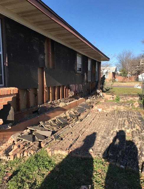 The after-effects of the explosion. As you can see, some bricks have been blown off. 