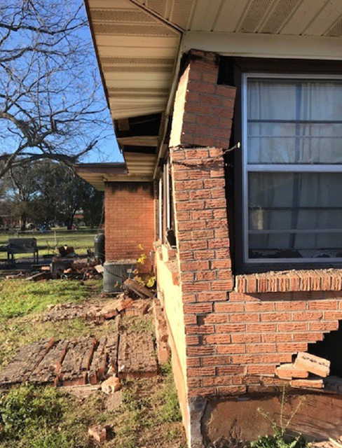 The after-effects of the explosion. As you can see, some bricks have been blown off. 