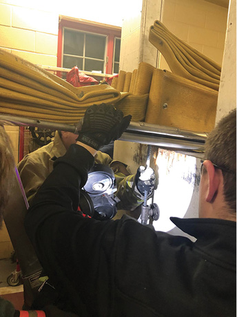 Teamwork is vital during incidents involving impalements. In some situations, the person making the cut may not be able to see and will have to rely heavily on the partner’s point of view for completing it. (Photos by author.) 