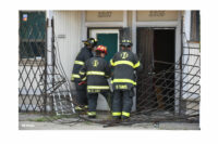 Indianapolis firefighters working at the scene.