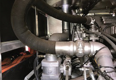 On this pumper, the two right-angle turns in the deck gun’s pipe between the discharge manifold and the base of the monitor will increase the friction loss. The pressure sensor is visible on the left side of the pipe, just above the discharge control valve.