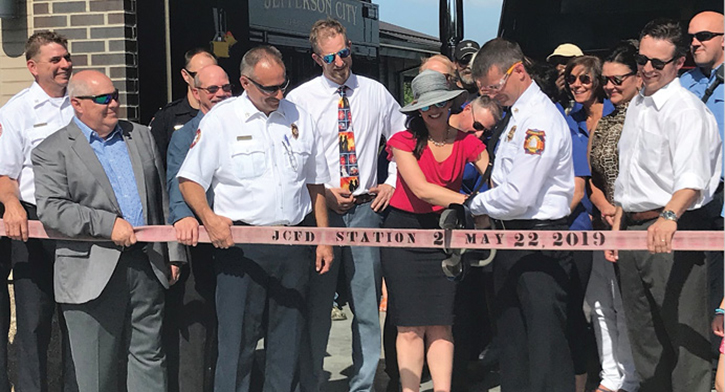 Dignitaries and fire department staff assist Mayor Carrie Tergin of Jefferson City in cutting the “ribbon” on the new fire station No. 2. (Photo by Teresa Clerkin.)