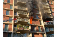 Flames showing from a window at the apartment complex.