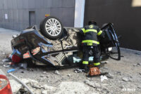 Firefighters working on the car.