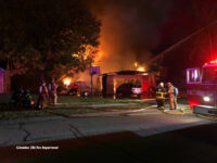 A fire in a camper extended to a two-story residence.