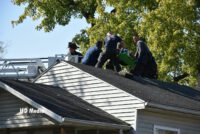 Firefighters rescue the injured patient from the home's roof