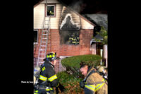 Firefighters at the scene of the residential fire.