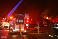 Fire burns a home as Indy firefighters and rigs get to work.