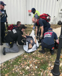 Responders move an injured victim.