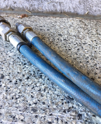 The outer (blue) protective jacket of this hose is getting stretched and thinned out because of expansion of the inner core. This hose should be replaced. 