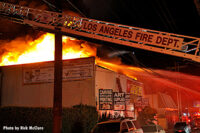 Los Angeles Fire Department aerial device at the scene of the fire