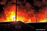 Another view of the flames rising from the structure