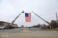 Massive American flag between two aerial devices