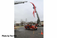 A photo of the old apparatus beneath the flag