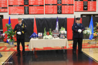 Firefighters stand watch during the funeral