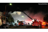 A view of aerial operations as firefighters adopted a defensive posture at this fire scene.