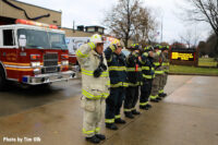 Firefighters salute the late chief.