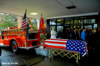 The casket containing the chief's remains to be loaded onto the rig.